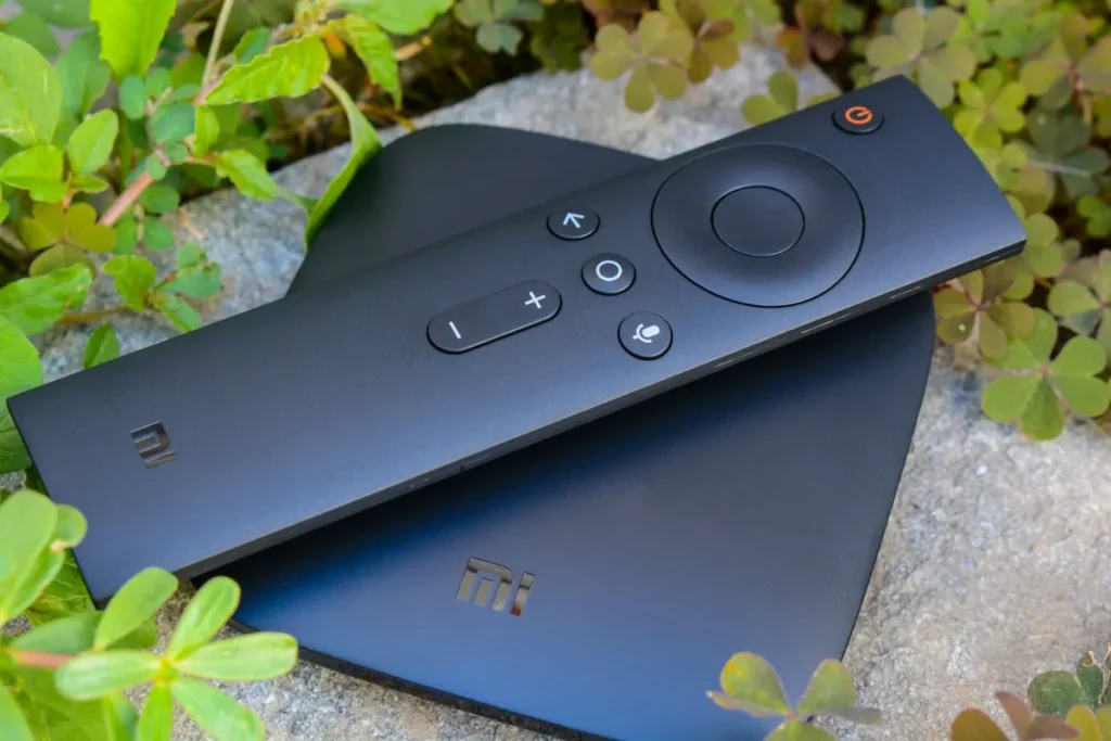 Android TV box with its remote control, the kind of device that runs most IPTV player apps