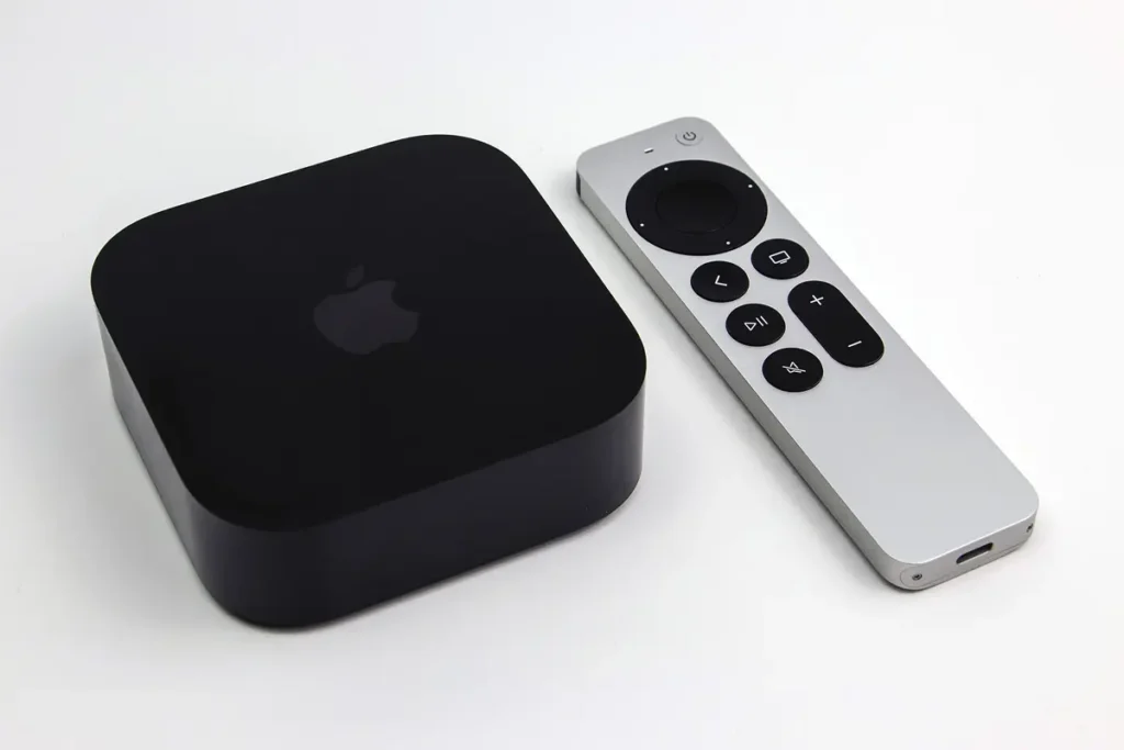 Apple TV 4K box beside its silver Siri Remote, an Apple device where the TiviMate vs IPTV Smarters choice is already made
