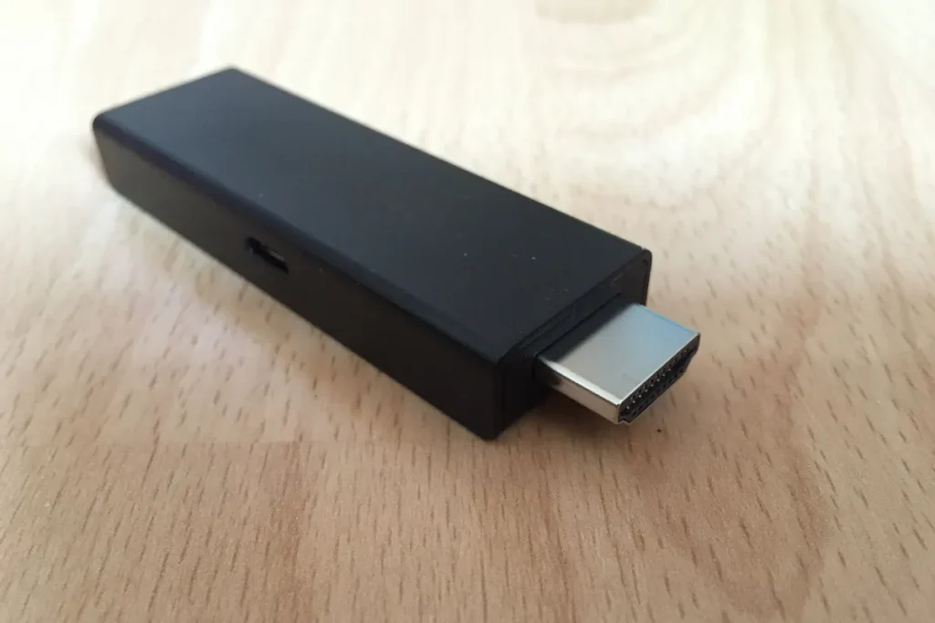 Close-up of an Amazon Fire TV Stick showing its HDMI connector and micro-USB power port