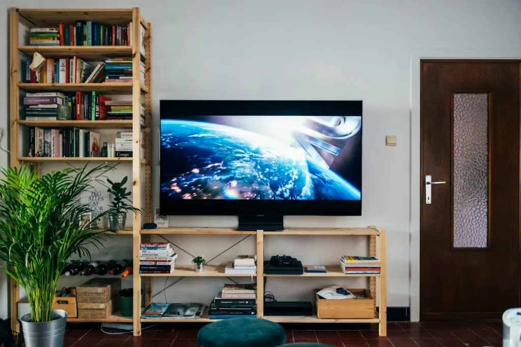 Large 4K TV on a wooden media unit in a living room, the kind of screen a Firestick 4K needs an HDCP 2.2 HDMI port for