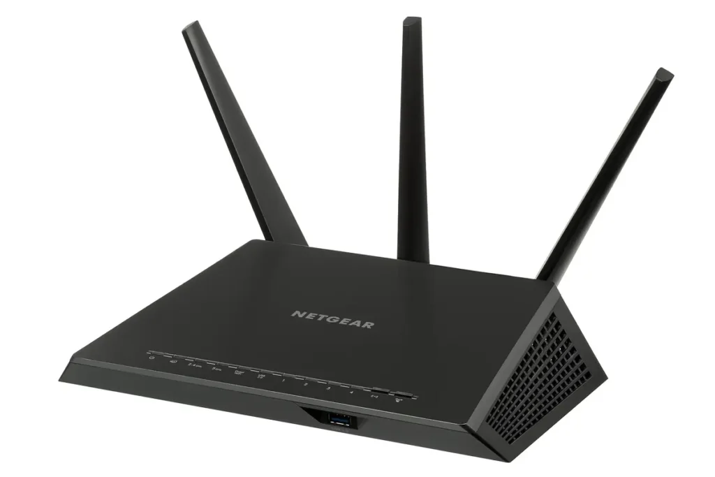 Black home Wi-Fi router with three external antennas, the kind often hidden in a hallway cupboard